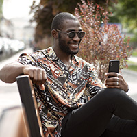 corgra man using smartphone
